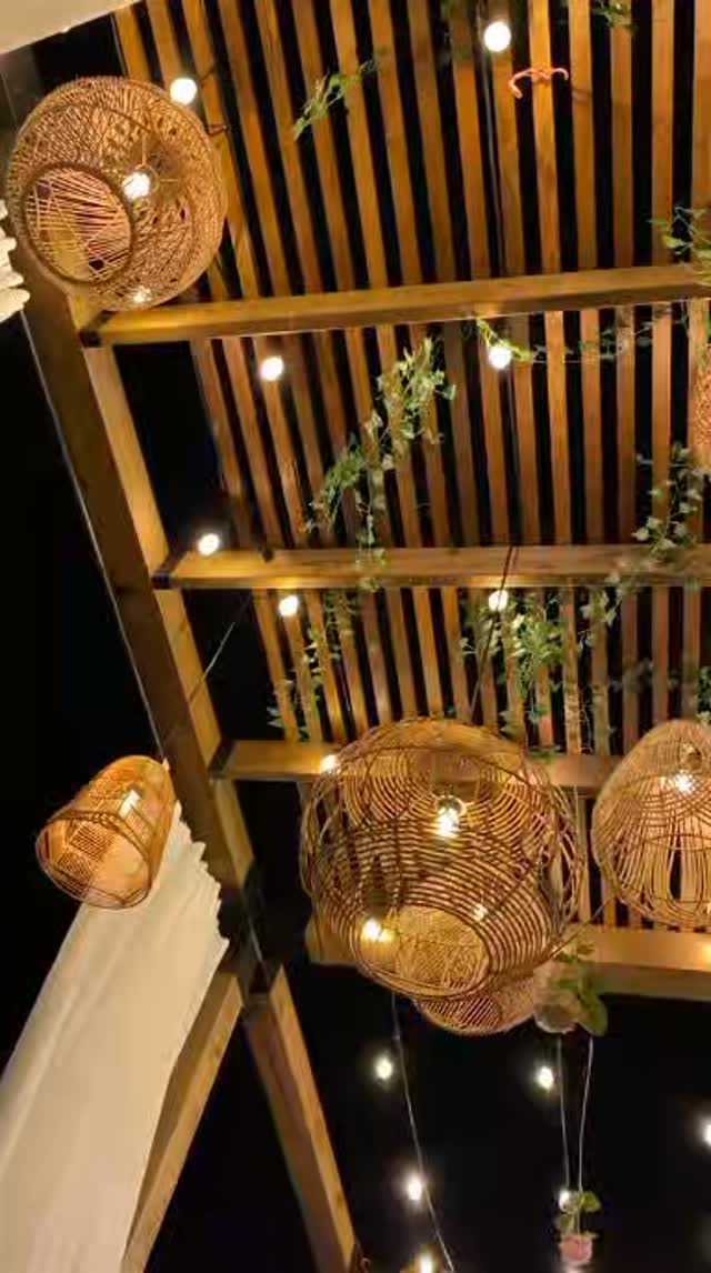 Rattan pendant lights on a timber slat ceiling